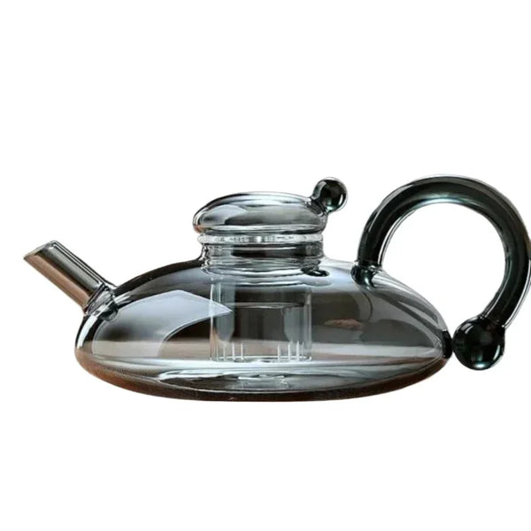 Elegant glass teapot with a modern black handle and heat-resistant borosilicate design.
